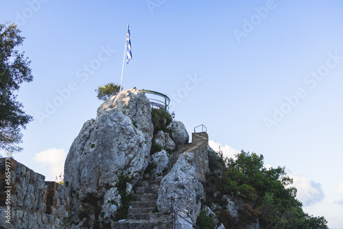 View of Kaiser's Throne observation deck lookout, Pelekas village, Corfu island, Greece, Kaiser William II summit Observatory panoramic summer view with mountains and Kerkyra in the background photo