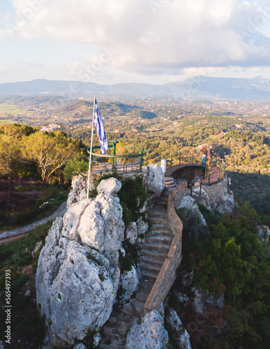 View of Kaiser's Throne observation deck lookout, Pelekas village, Corfu island, Greece, Kaiser William II summit Observatory panoramic summer view with mountains and Kerkyra in the background photo