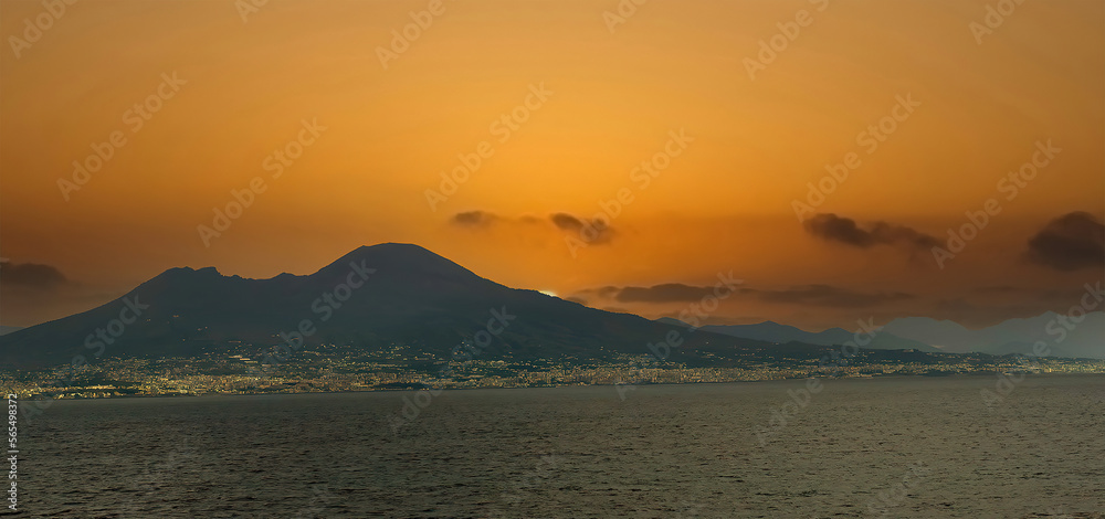 Sun breaking through clouds on the Gulf of Naples