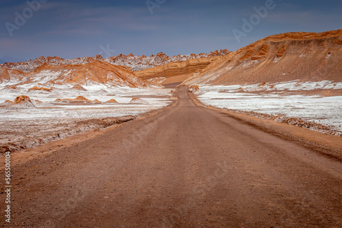 Obraz na płótnie Dirt road in Moon Valley dramatic landscape at Sunset, Atacama Desert, Chile w salonie