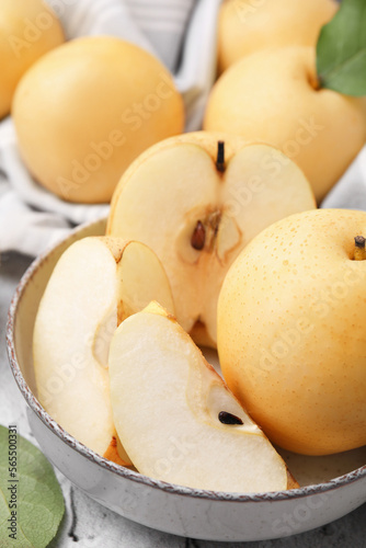 Delicious apple pears on white textured table, closeup