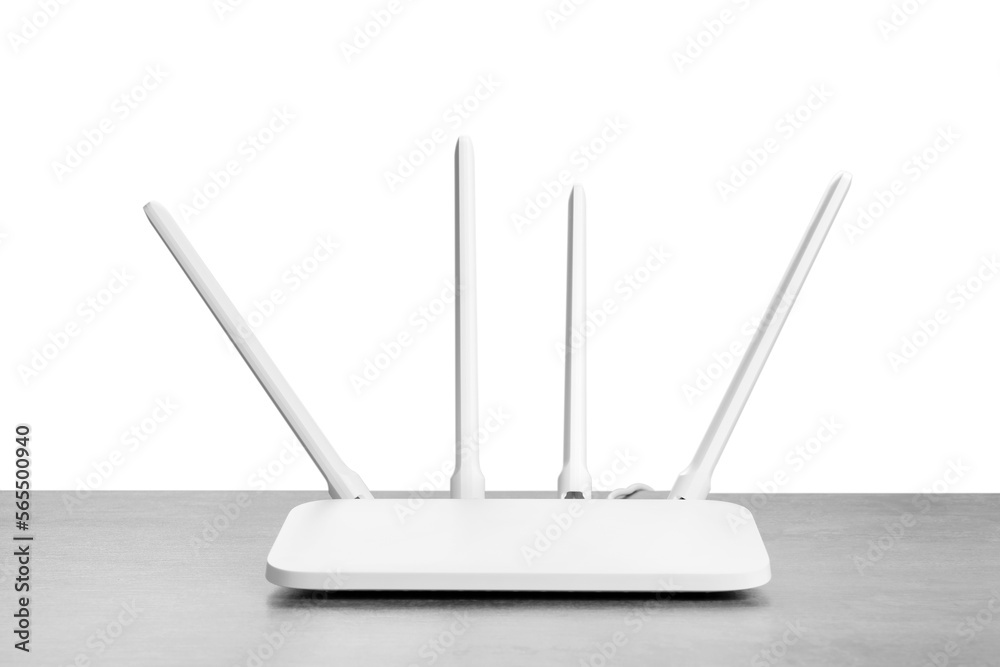 New modern Wi-Fi router on grey table against white background New modern Wi-Fi router on grey table against white background
