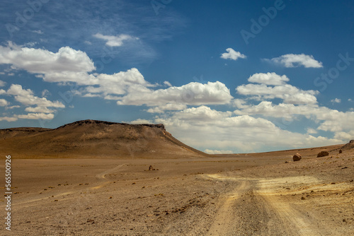 Dirt road in Moon Valley dramatic landscape at Sunset, Atacama Desert, Chile