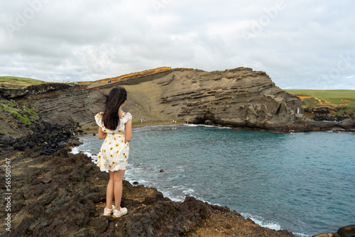 A Girl Looking at Mahana Green Sand Beach in Big Island photo