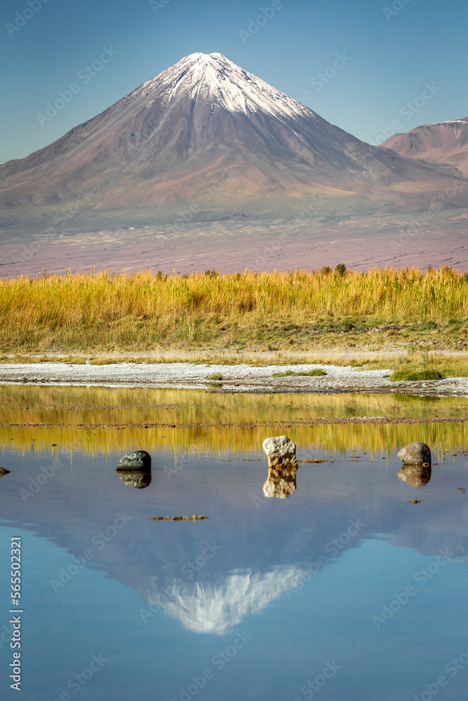 Licancabur with reflection lake and volcanic landscape at Sunset, Atacama, Chile