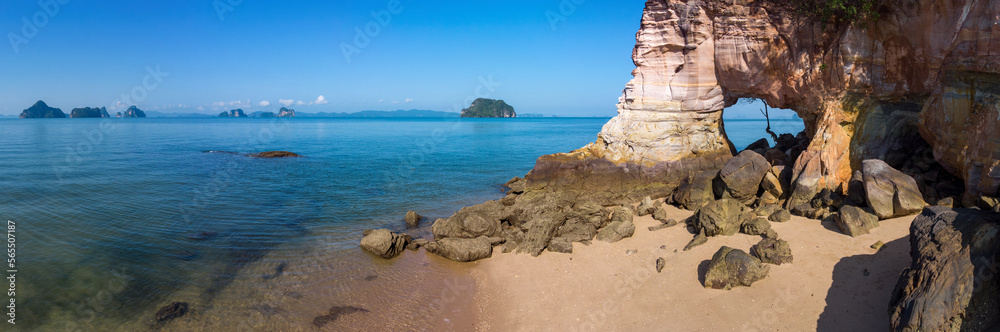 Hole in the rock. View of Laem Chamuk Khwai Rock and Beach on sunny day. Thalane, Krabi Province, Thailand.