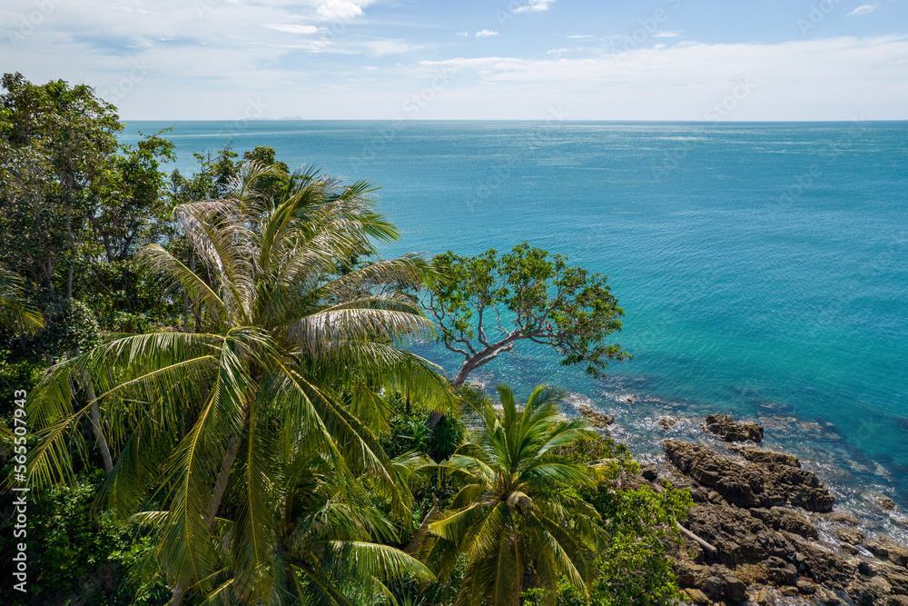Tropical trees and Andaman Sea on sunny day. Ko Lanta island, Krabi Province, Thailand.