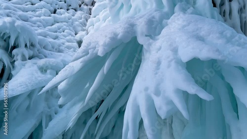 Wallpaper Mural Frozen winter lake Baikal, Siberia, Russia. Ice icicles and blocks in the rocks, grottoes and caves at dawn. Natural background of cold ice. Winter abstract background. High quality 4k footage Torontodigital.ca