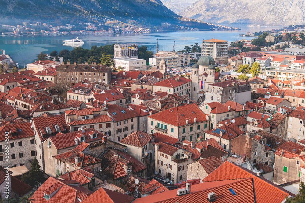 Kotor, Montenegro, beautiful top panoramic view of Kotor city old medieval town seen from San Giovanni St. John Fortress, with Adriatic sea, bay of Kotor and Dinaric Alps mountains in a sunny day
