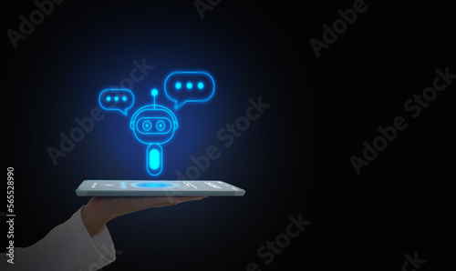 Digital chatbot, conversational agents, robot application, conversation assistant that mimic human speech. Hand holding a tablet with digital AI chatterbot on virtual screen for online information.