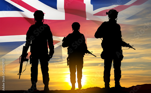 Silhouettes of soldiers with United Kingdom flag on background of sky. Background for Remembrance Day. United Kingdom Armed Forces concept. EPS10 vector