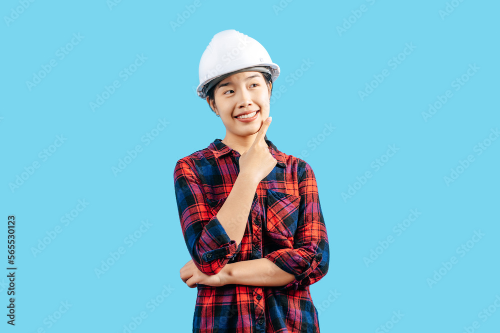 Young asian engineer female wearing helmet point finger posture Young asian engineer female wearing helmet point finger posture