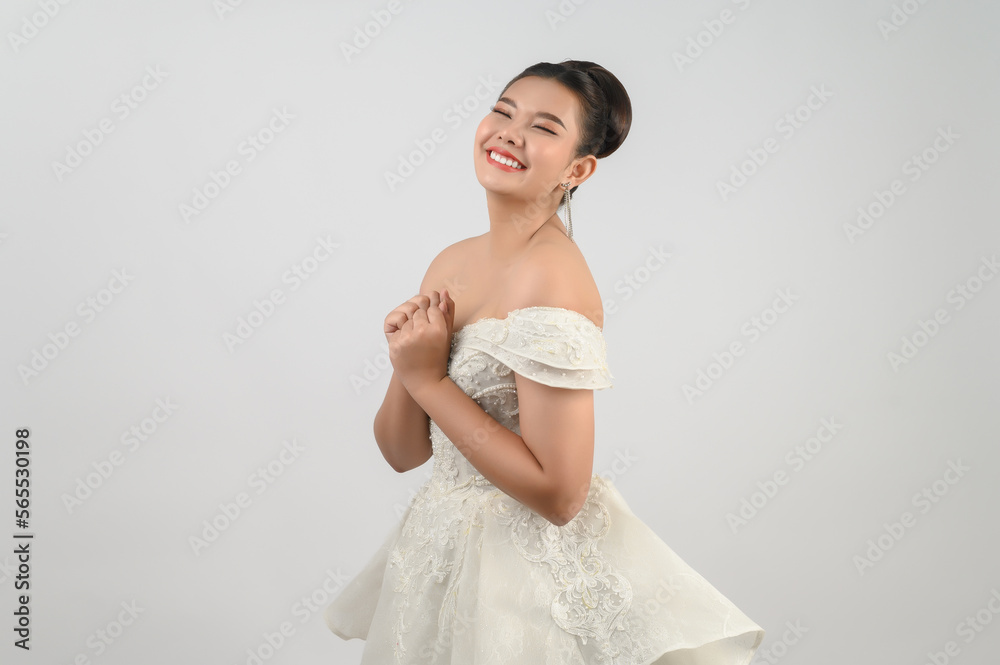 Young asian beautiful bride smile with happy on white background Young asian beautiful bride smile with happy on white background
