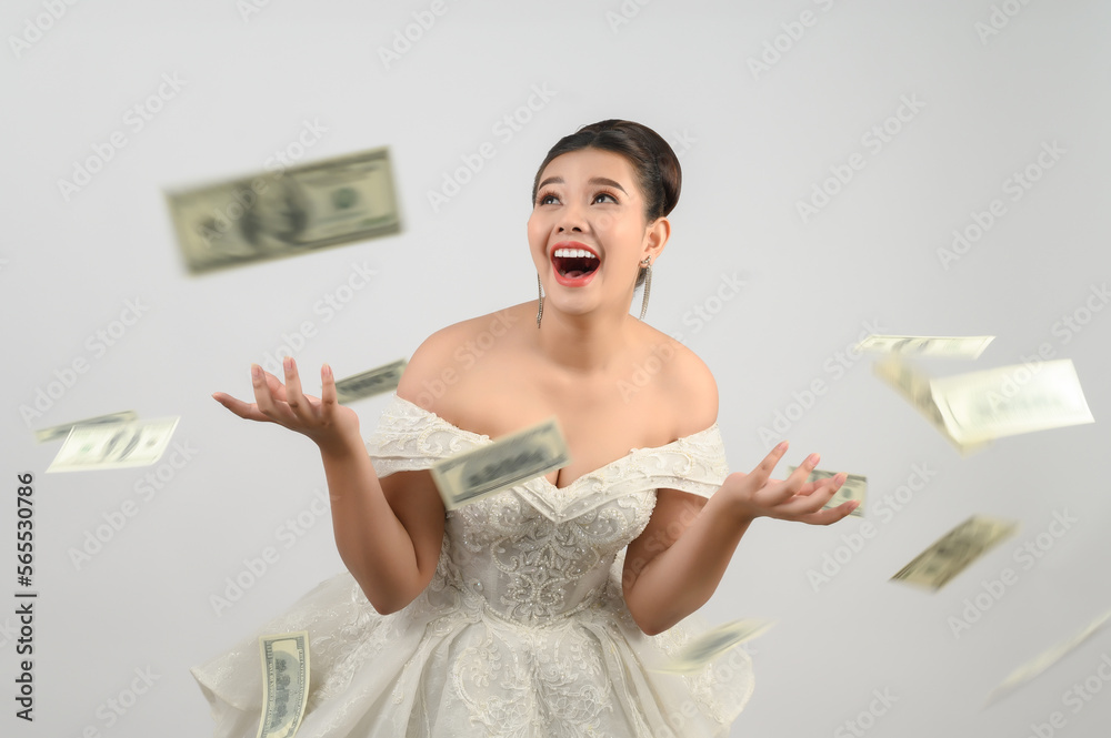 Young asian beautiful bride holding dollar bills in hand Young asian beautiful bride holding dollar bills in hand