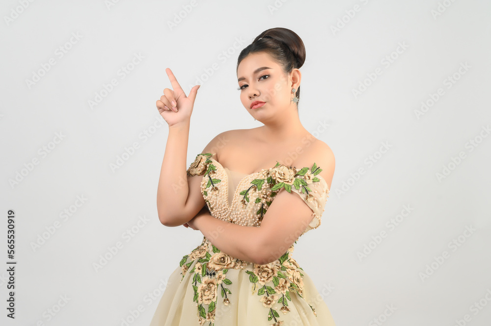 Young asian beautiful bride point finger with happy on white background Young asian beautiful bride point finger with happy on white background