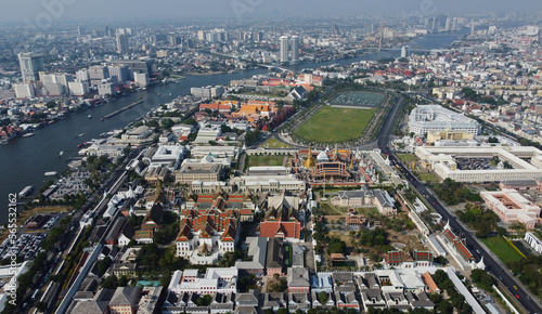 Aerial panoramic view of Grand Palace complex, bottom, in Bangkok, Thailand. The Temple of the Emerald Buddha, right, Sanam Luang park and the Chao Phraya river are seen in the background.