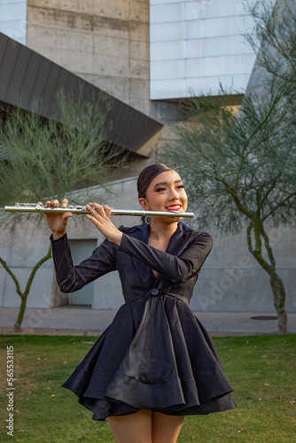 flute flutist model arizona phoenix science center model performance concert musician beautiful glame player music red lipstick black dress urban city event concerts photo