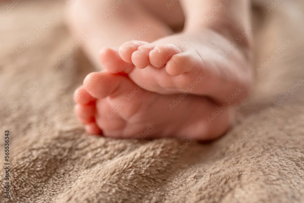 Cute sleeping newborn. Feet of a small child Cute sleeping newborn. Feet of a small child