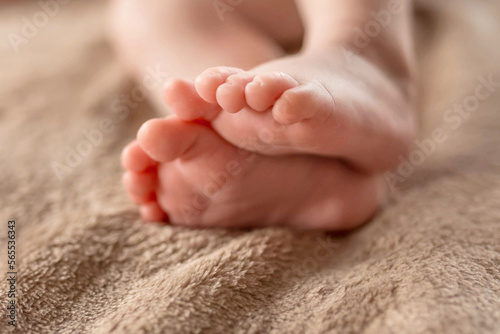 Cute sleeping newborn. Feet of a small child
