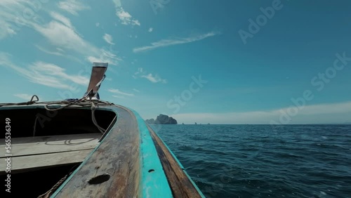 A longtail boat sailing in the ocean, Thailand