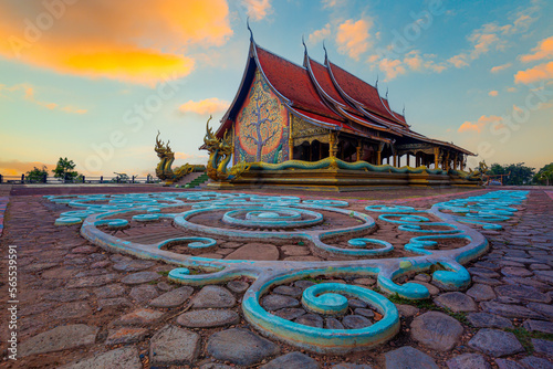 Amazing Temple Sirindhorn Wararam Phuproud in Ubon Ratchathani Province at twilight time,Thailand.Thai temple with grain and select white balance © banjongseal324