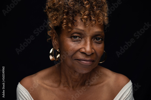 Beautiful elderly African American senior citizen widow looking at camera with neutral serious expression