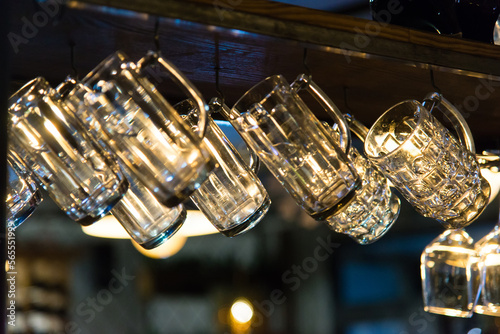 beer glasses hanging on the bar