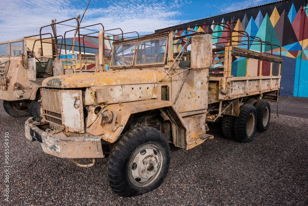 Old abandoned and rusty sand colored military truck