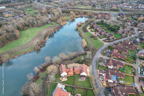 Aerial View of Residential Homes Near Tongwell Lake of Milton Keynes City of England Just Before Sunset. Drone's Camera Footage photo