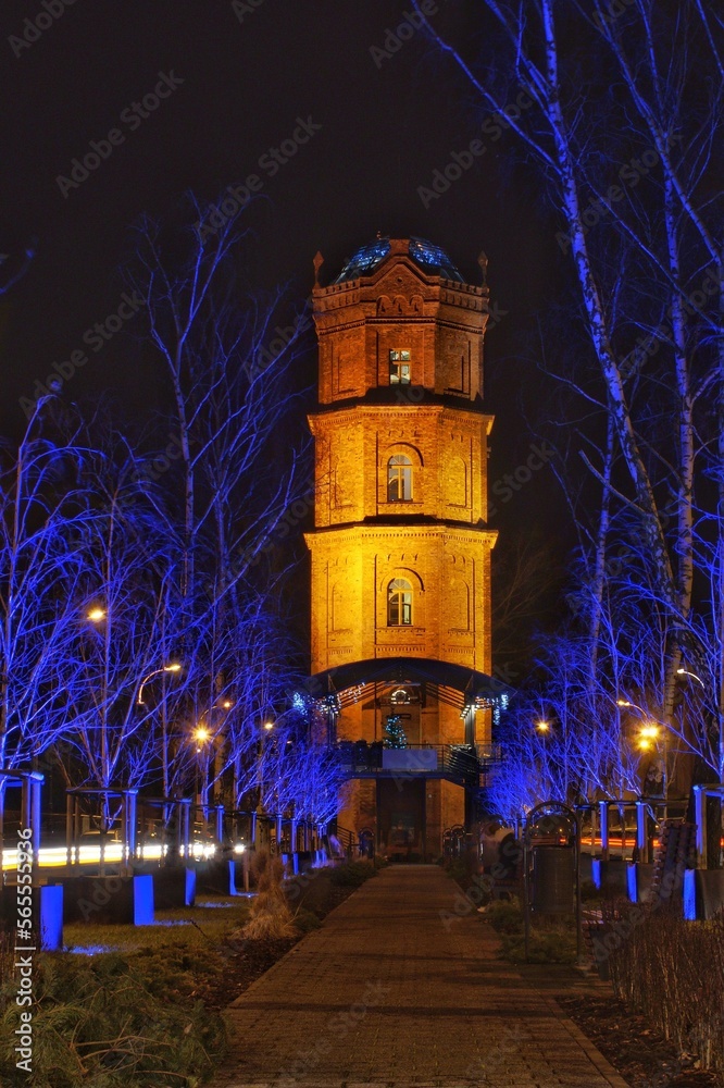The water tower in Płock, built at the end of the 19th century, at night.