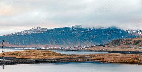Icelandic landscape - a town with mountains and lake
