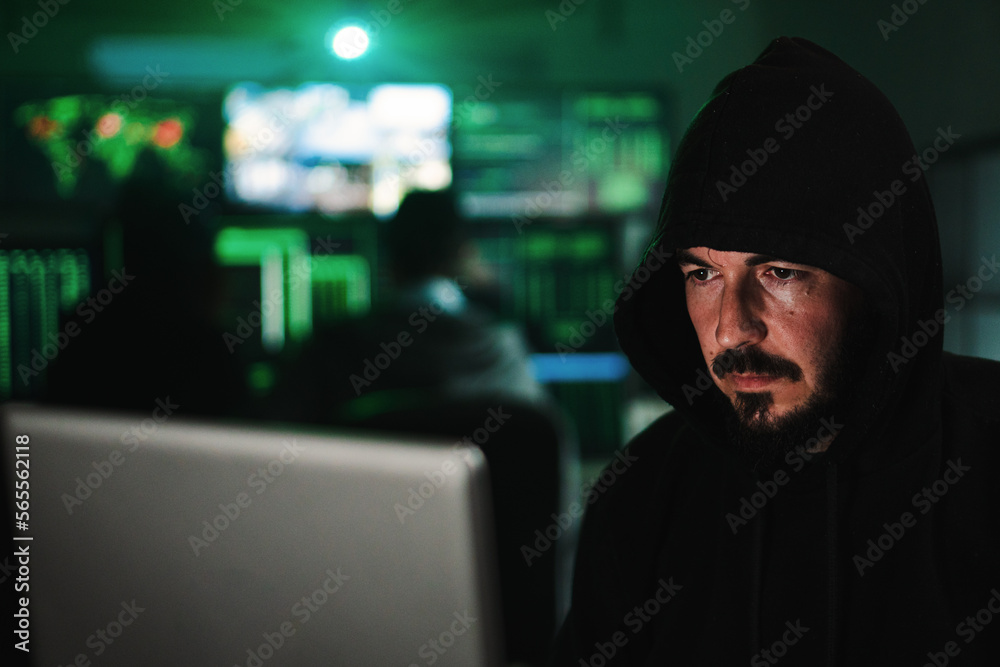 Close up portrait of one hacker looking the screen of a laptop computer, typing the code to breack the security of the firewall on internet. High quality photo Close up portrait of one hacker looking the screen of a laptop computer, typing the code to breack the security of the firewall on internet. High quality photo