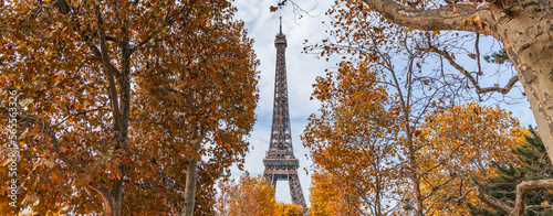 Eiffel Tower surrounded by colored leaves on a day of Autumn in October in Paris, France © JeanLuc Ichard