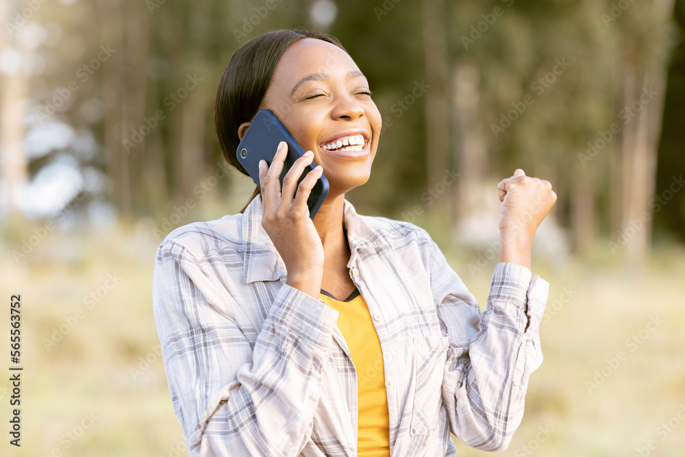 African woman, celebrate and fist with phone call, outdoor or smile for winning, success or goal in summer. Adventure, smartphone conversation or good news for girl in sunshine, forest or celebration African woman, celebrate and fist with phone call, outdoor or smile for winning, success or goal in summer. Adventure, smartphone conversation or good news for girl in sunshine, forest or celebration