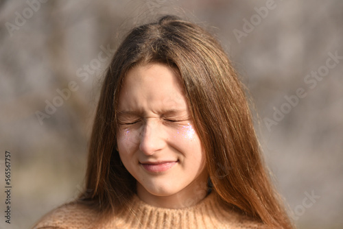 Portrait of a curvy young girl. Girl closed her eyes