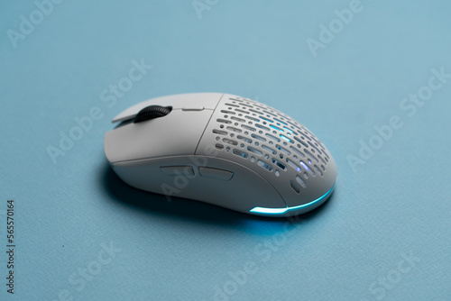 white new wireless computer mouse flat lay with led lights