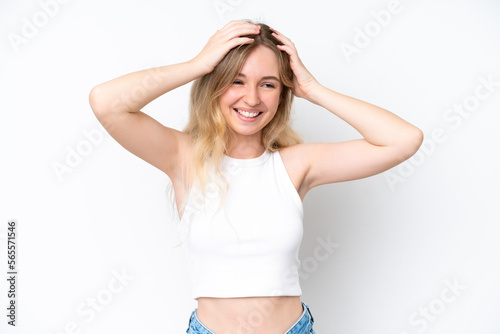 Blonde English young girl isolated on white background laughing