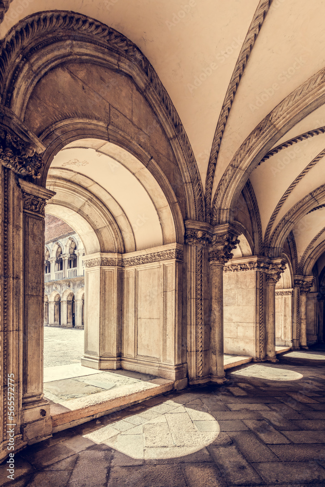 Ancient columns with arches at Palazzo Ducale or Doge's Palace in Venice, Italy