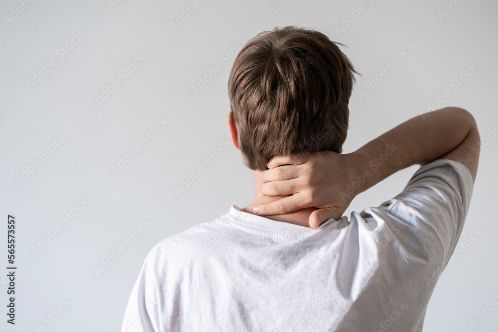 male person holding neck, feeling pain, sick and tired male person holding neck, feeling pain, sick and tired