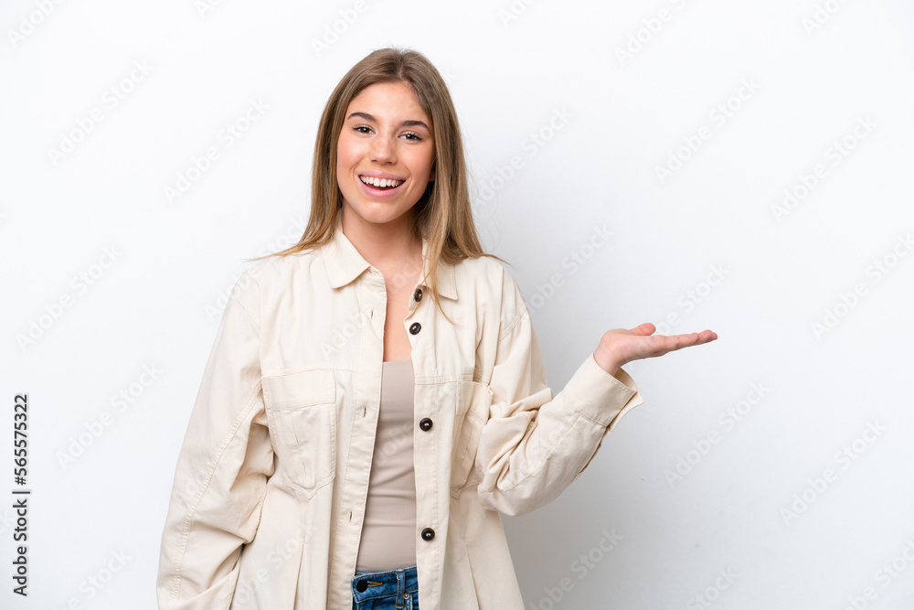 Young caucasian woman isolated on white bakcground holding copyspace imaginary on the palm to insert an ad Young caucasian woman isolated on white bakcground holding copyspace imaginary on the palm to insert an ad