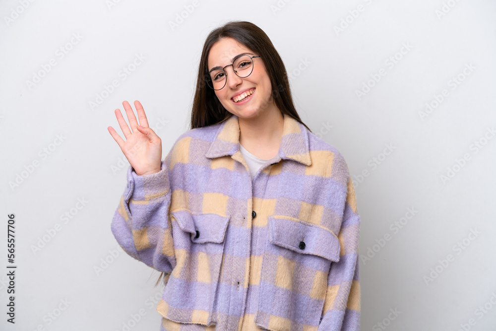 Young girl isolated on white background saluting with hand with happy expression Young girl isolated on white background saluting with hand with happy expression