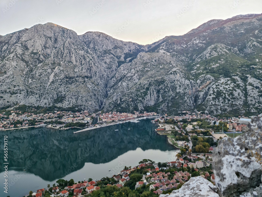 Panoramic view from mountain summit of Sveti Ilija on Kotor bay during sunrise, Adriatic Mediterranean Sea, Montenegro, Balkans, Europe. Fjord winding along steep cliffs. Hiking trail in Dinaric Alps Panoramic view from mountain summit of Sveti Ilija on Kotor bay during sunrise, Adriatic Mediterranean Sea, Montenegro, Balkans, Europe. Fjord winding along steep cliffs. Hiking trail in Dinaric Alps