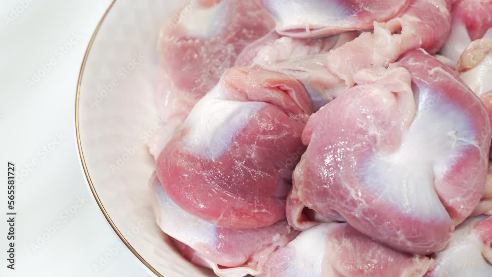 Fresh chicken gizzards on a solid color background Fresh chicken gizzards on a solid color background