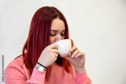 woman drinking coffee on white background 