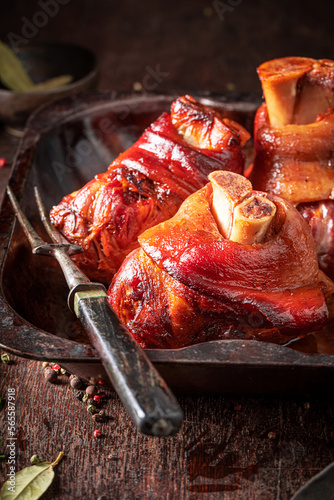 Canvas Print Aromatic Schweinshaxe baked in casserole with spices.