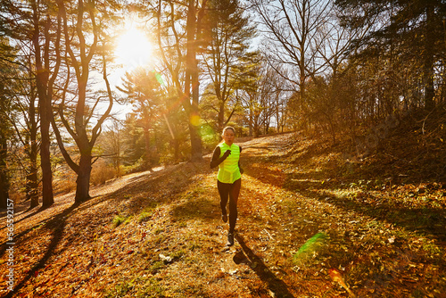 A Woman Running In The Park At Arnold Arboretum
