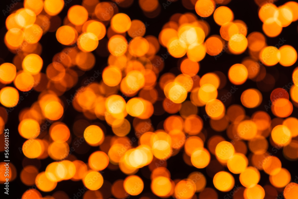 Golden defocused circles of light in bokeh effect on a black background Golden defocused circles of light in bokeh effect on a black background