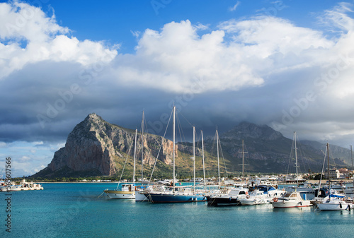 Sailing boats in the port of San Vito Lo Capo town, Sicily island, Italy. Popular travel destination, beautiful landmark