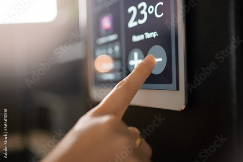 Smart home system, wall and woman hands with digital app monitor for thermostat heating, temperature control or house automation. Future AI software, ui air conditioning panel and girl with IOT tech photo