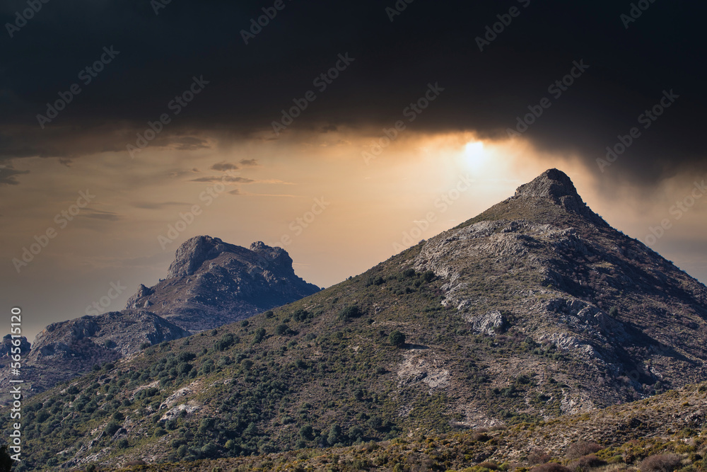 sunset over the mountains in a natural park (Granada, Spain)